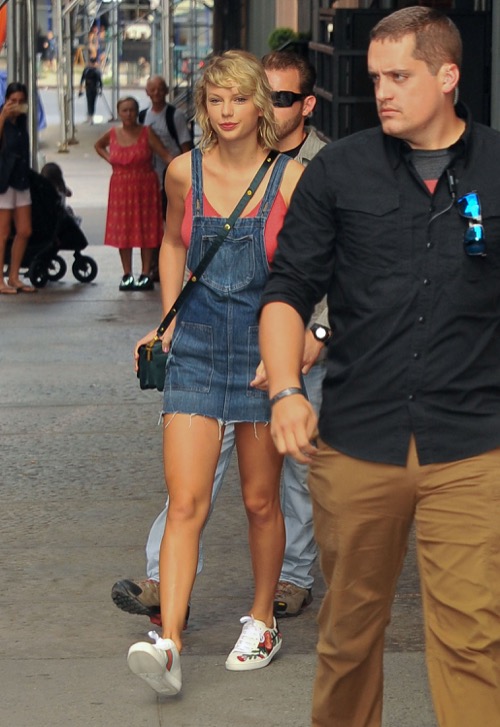 Taylor Swift stepping out of her apartment in New York City on